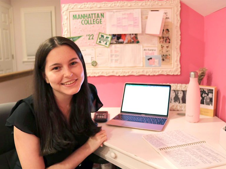 Ciara smiling at her make-shift office at home